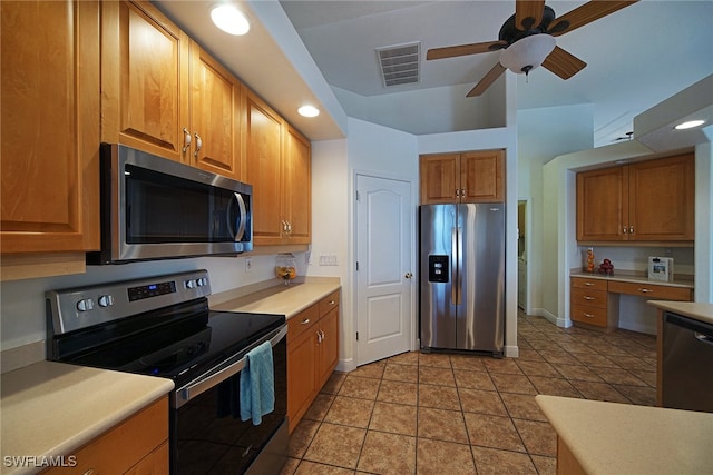 kitchen featuring ceiling fan, light tile patterned floors, and appliances with stainless steel finishes