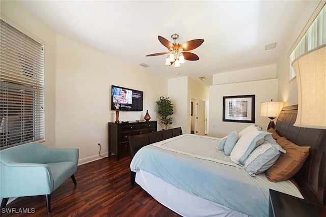 bedroom with dark wood-type flooring and ceiling fan