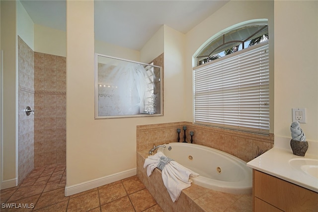 bathroom featuring tile patterned floors, separate shower and tub, and vanity