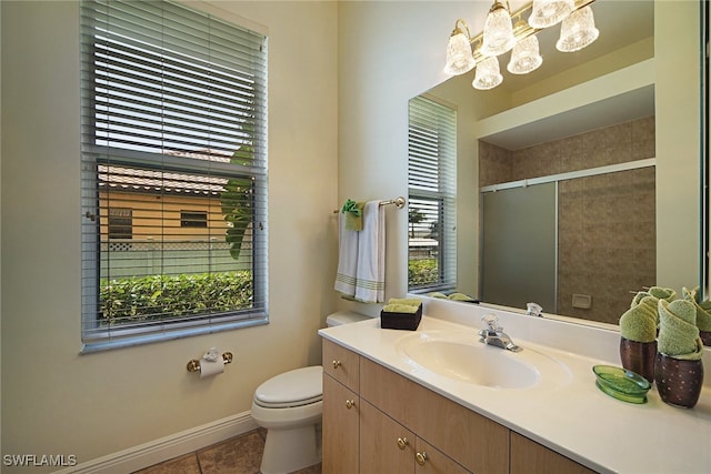 bathroom with a shower with shower door, tile patterned flooring, plenty of natural light, and toilet