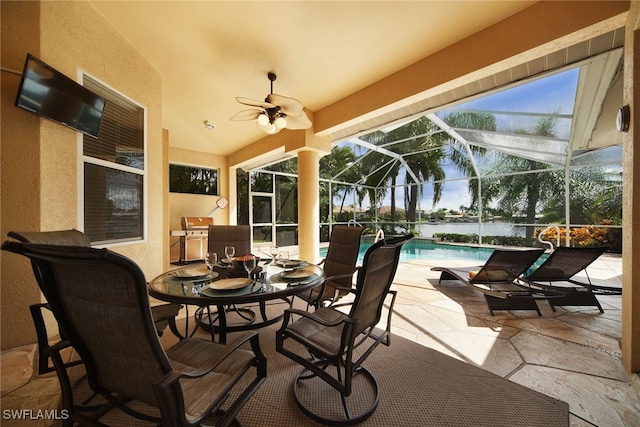 view of patio / terrace with glass enclosure and ceiling fan