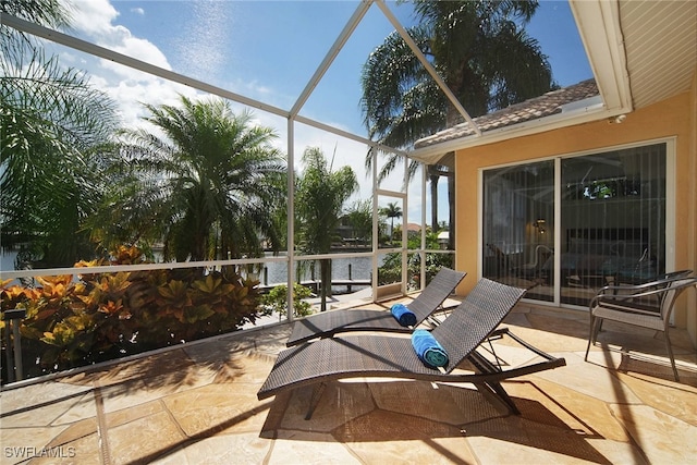 sunroom / solarium with a water view