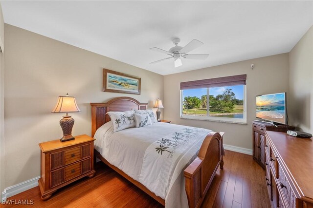 bedroom featuring ceiling fan and dark hardwood / wood-style flooring