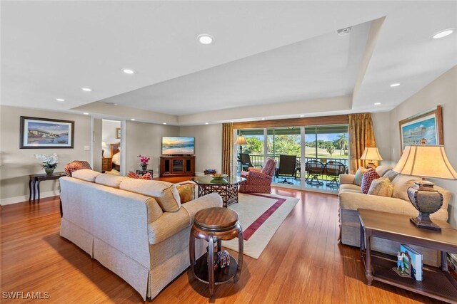 living room with light hardwood / wood-style flooring