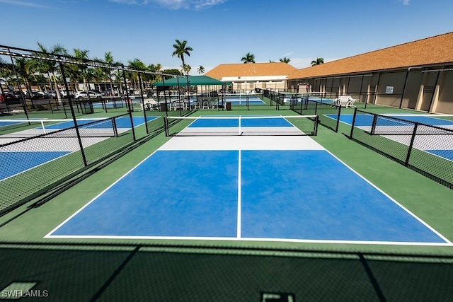 view of tennis court featuring basketball court