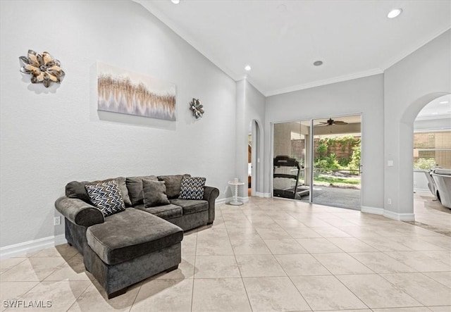 living room featuring light tile patterned floors and ornamental molding