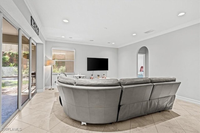 living room featuring light tile patterned floors and ornamental molding