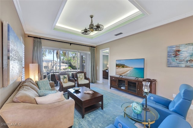 living room featuring a notable chandelier and crown molding