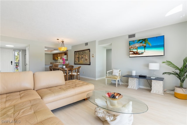 living room with light hardwood / wood-style flooring