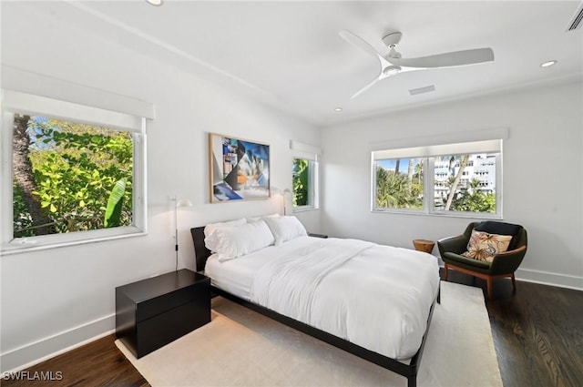 bedroom featuring recessed lighting, dark wood finished floors, visible vents, and baseboards