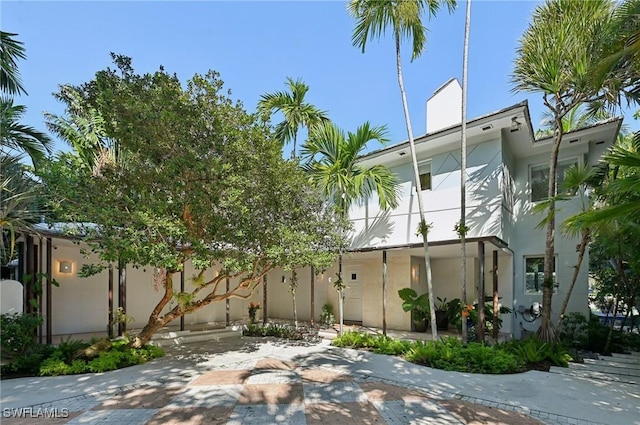 view of side of home featuring stucco siding