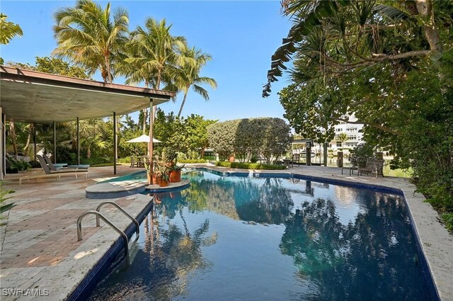 outdoor pool featuring a patio area