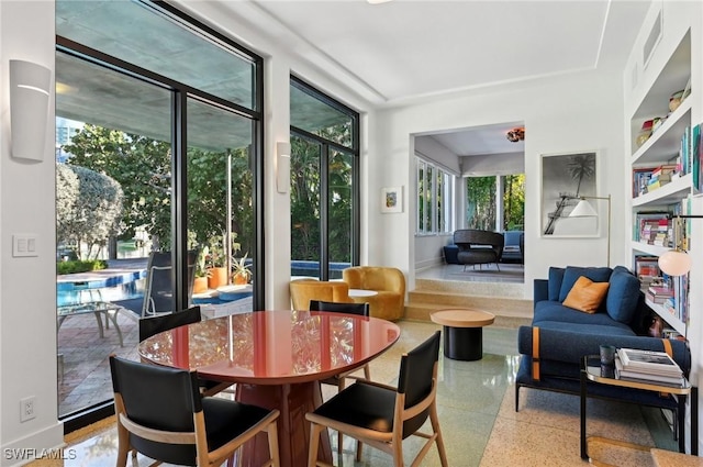 sunroom / solarium featuring visible vents