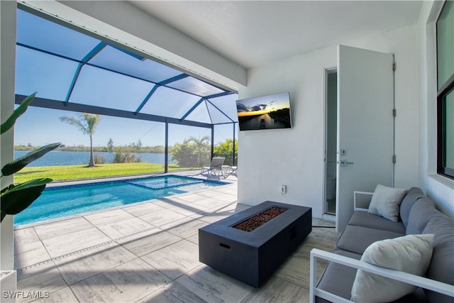 view of pool featuring a lanai, a patio area, a water view, and an outdoor living space with a fire pit