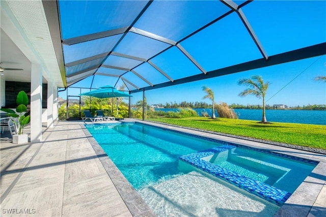 view of swimming pool with glass enclosure, a patio area, a water view, and ceiling fan