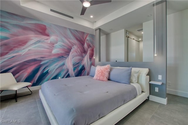 bedroom with ceiling fan and light tile patterned floors