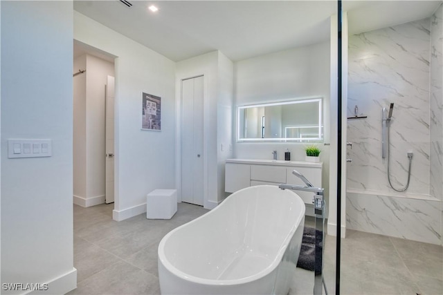 bathroom with vanity and separate shower and tub