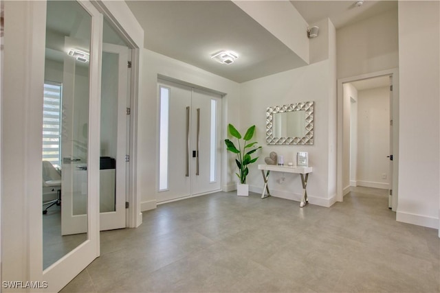 entryway featuring french doors