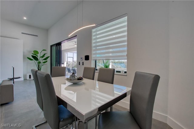 dining space featuring concrete floors