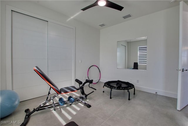 exercise room with ceiling fan