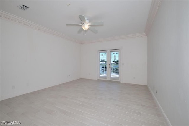 spare room featuring ceiling fan and crown molding