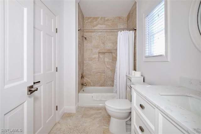 full bathroom featuring shower / bath combo, toilet, and vanity