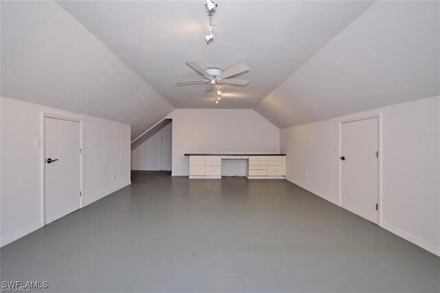 additional living space featuring ceiling fan and lofted ceiling