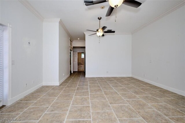 unfurnished room with light tile patterned floors and ornamental molding