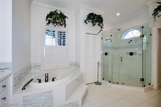 bathroom featuring tile patterned floors, vanity, separate shower and tub, and crown molding