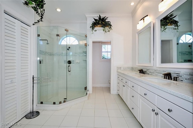 bathroom with tasteful backsplash, walk in shower, ornamental molding, and toilet