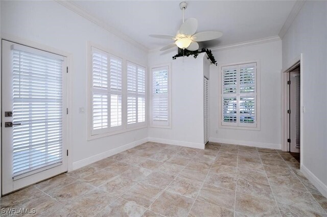 unfurnished room with ceiling fan and crown molding