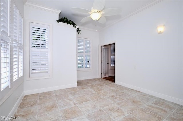 spare room with ceiling fan and crown molding