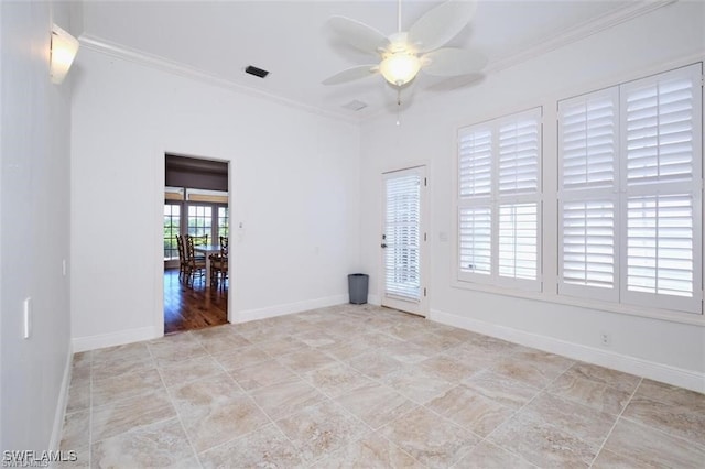 spare room with ceiling fan and crown molding