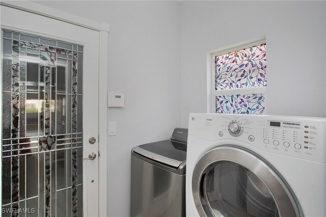 laundry room with washer and clothes dryer