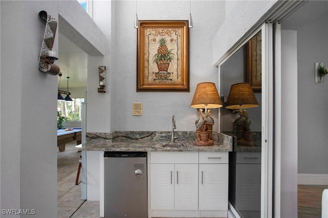 159 Lady Palm Dr, Naples, FL 34104 - indoor wet bar featuring stainless steel dishwasher, a textured wall, light tile patterned floors, and billiards table