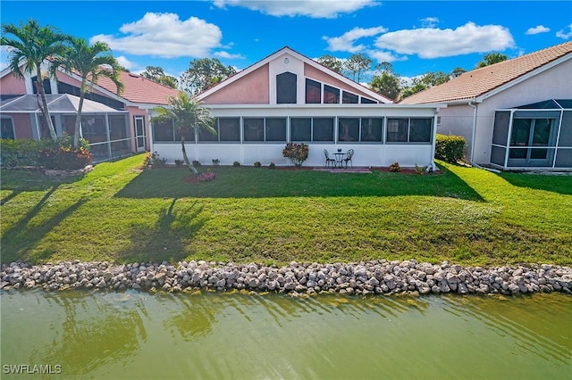 159 Lady Palm Dr, Naples, FL 34104 - back of property with a sunroom, a yard, and a water view