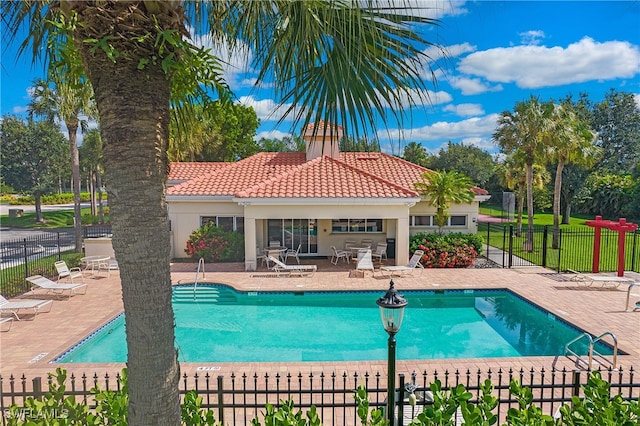 view of swimming pool with a patio