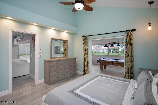 bedroom featuring ceiling fan, light hardwood / wood-style flooring, billiards, and vaulted ceiling