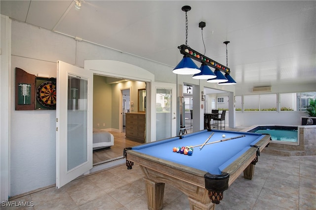 rec room featuring tile patterned floors, a healthy amount of sunlight, and billiards