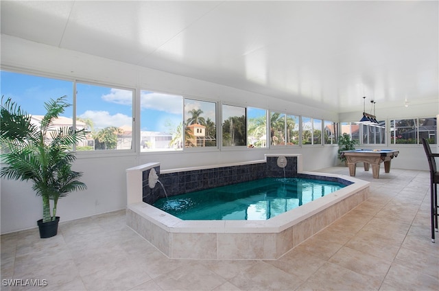 view of pool featuring pool water feature and an indoor hot tub