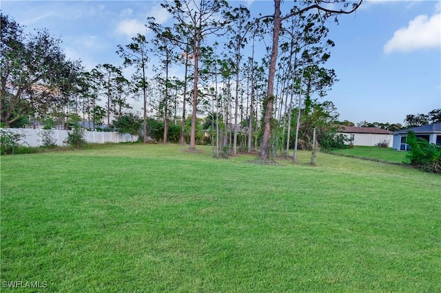 view of yard with fence