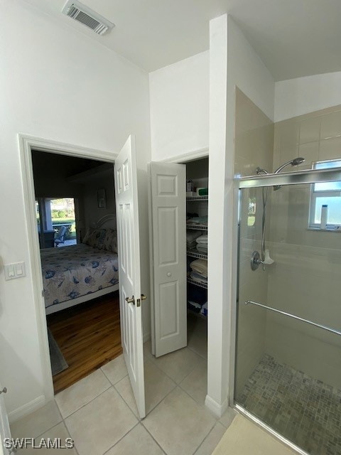 13358 Queen Palm Run, North Fort Myers, FL 33903 - ensuite bathroom with ensuite bath, visible vents, tile patterned flooring, and a stall shower