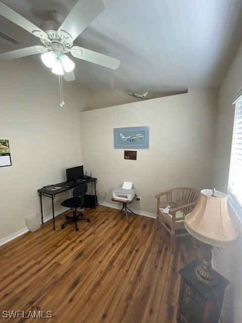 home office with dark hardwood / wood-style floors, ceiling fan, a healthy amount of sunlight, and lofted ceiling