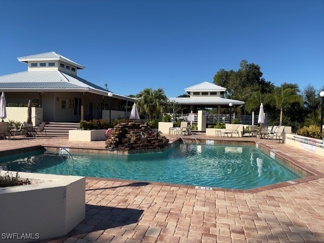 view of swimming pool with a patio area