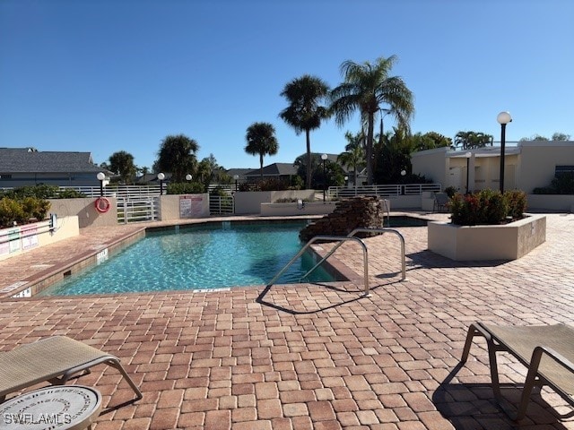 view of swimming pool with a patio area