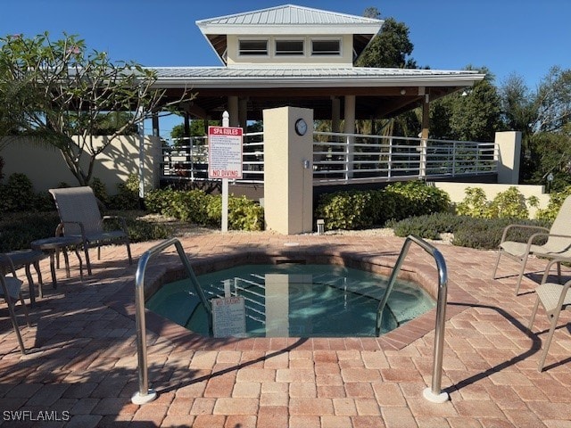 13358 Queen Palm Run, North Fort Myers, FL 33903 - view of swimming pool featuring a patio, a community hot tub, and fence