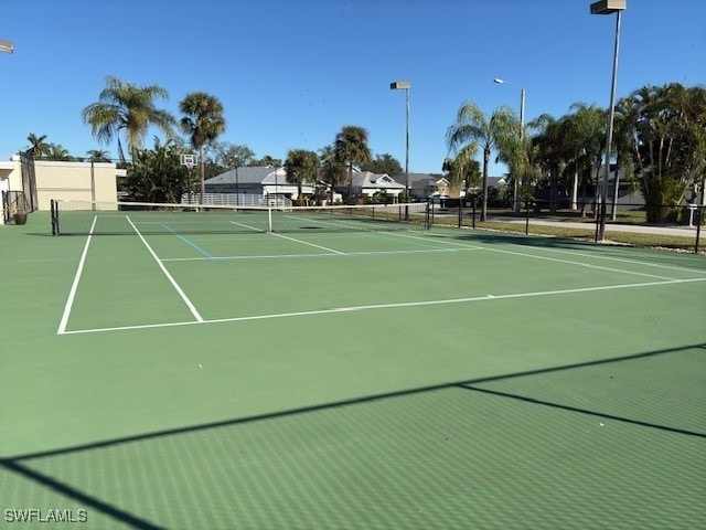 13358 Queen Palm Run, North Fort Myers, FL 33903 - view of tennis court featuring fence
