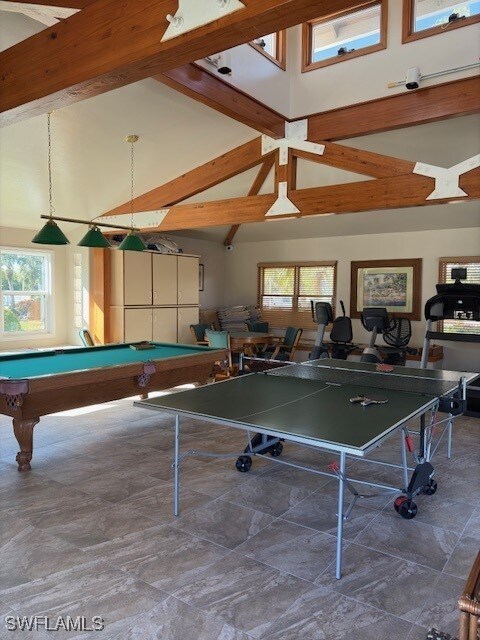 game room with beamed ceiling, high vaulted ceiling, and pool table