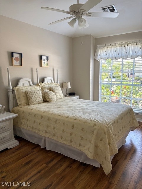13358 Queen Palm Run, North Fort Myers, FL 33903 - bedroom featuring a ceiling fan, visible vents, multiple windows, and dark wood-style floors