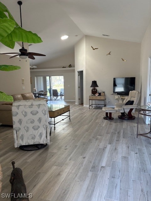 13358 Queen Palm Run, North Fort Myers, FL 33903 - living room featuring high vaulted ceiling, light wood-style floors, and ceiling fan